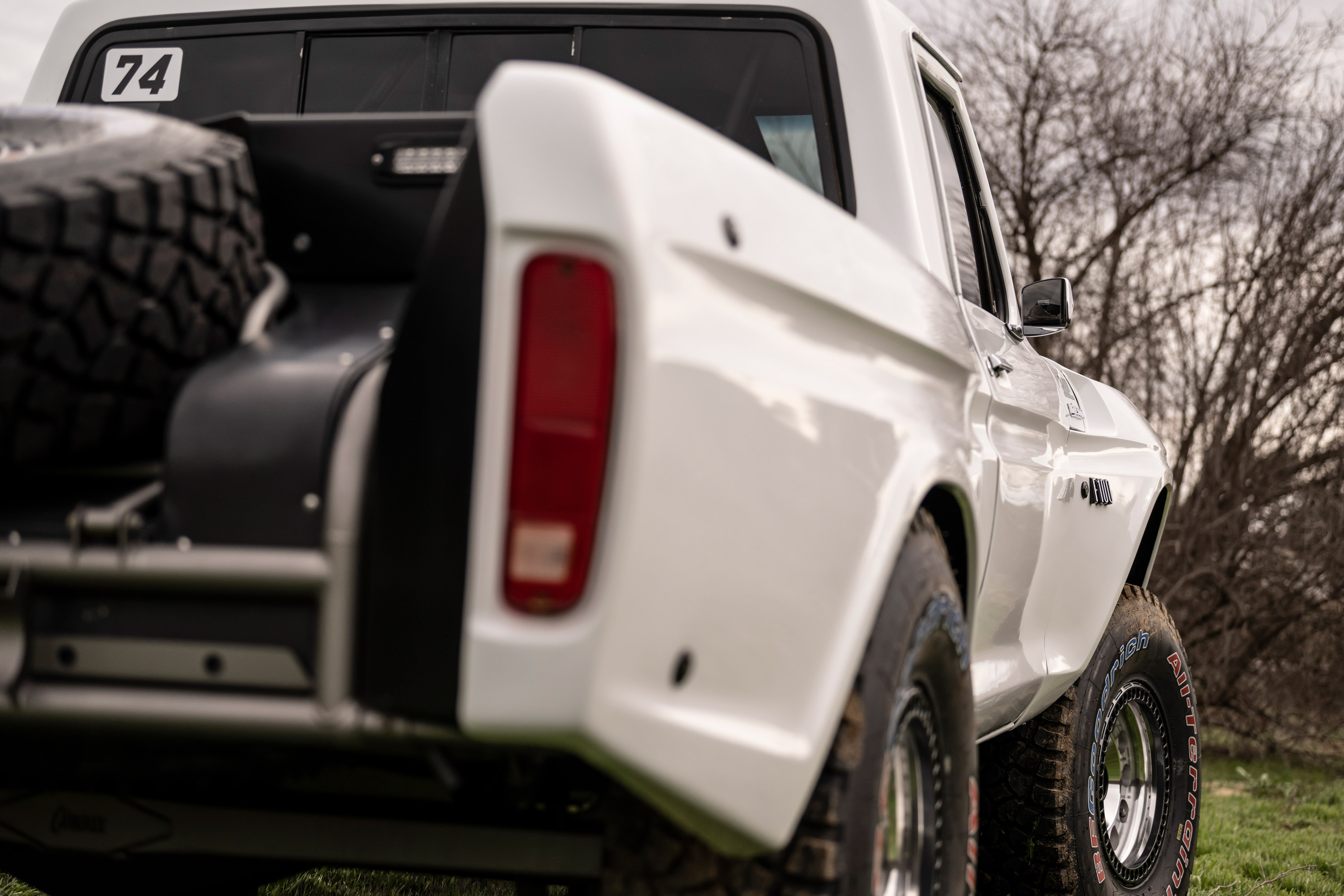 Static image of 1974 Ford F100 truck rear